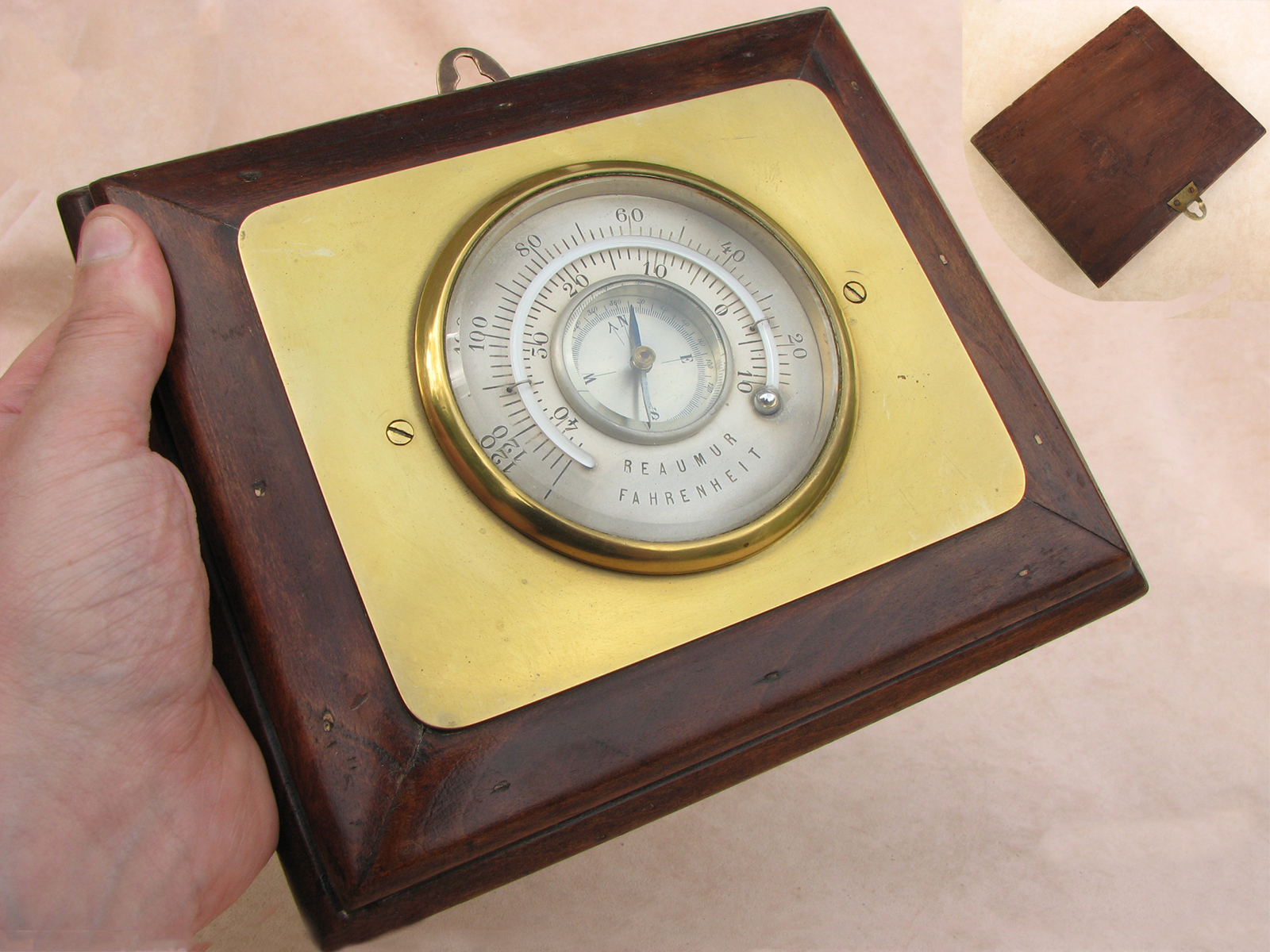 Unusual compass and thermometer combination mounted on wooden backboard
